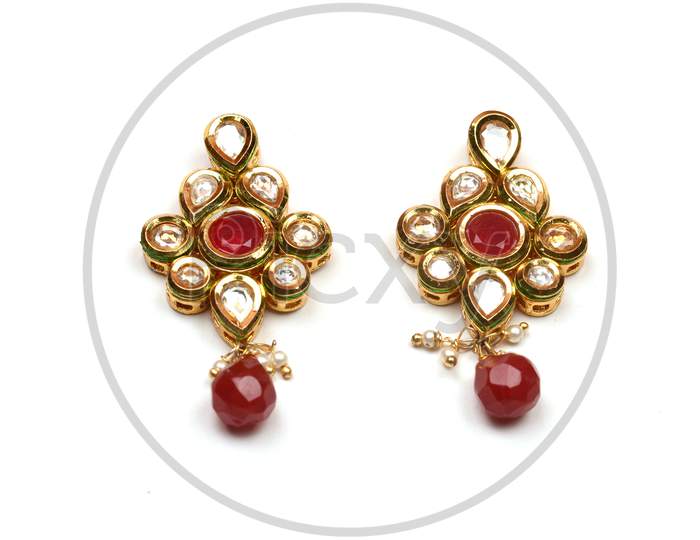 Beautiful Golden Pair Of Earrings Diamonds Gemstones On White Background. Luxury Female Jewelry, Indian Traditional Jewellery, Kundan Earring,Bridal Gold Earrings Wedding Jewellery
