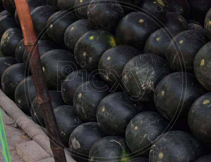 Watermelon sell on Asian street stall (low key photography)