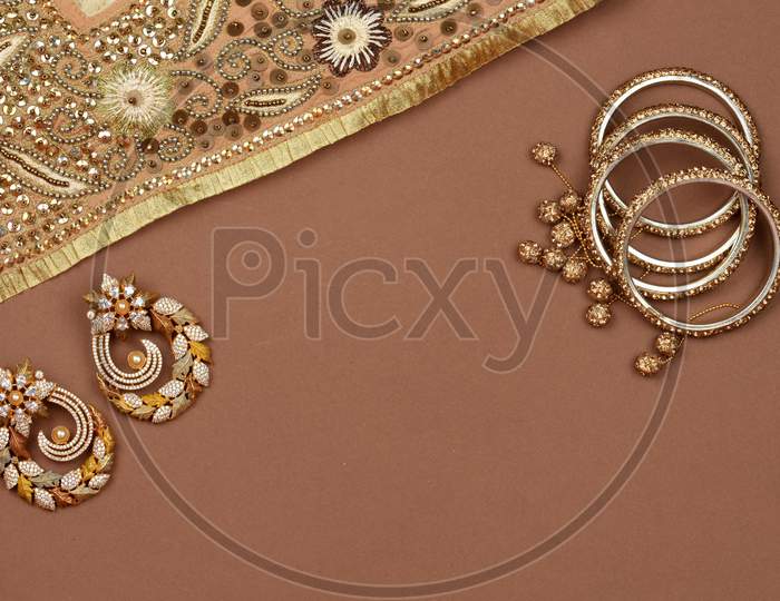 Pearl Jewelry On A Brown Background, Golden Scarf, Pearl Bracelet, Jewelry Background, Pearl Necklace, Pearl Earrings, Finger Ring.Style, Fashion And Design Of Jewelry. Indian Traditional Jewellery,