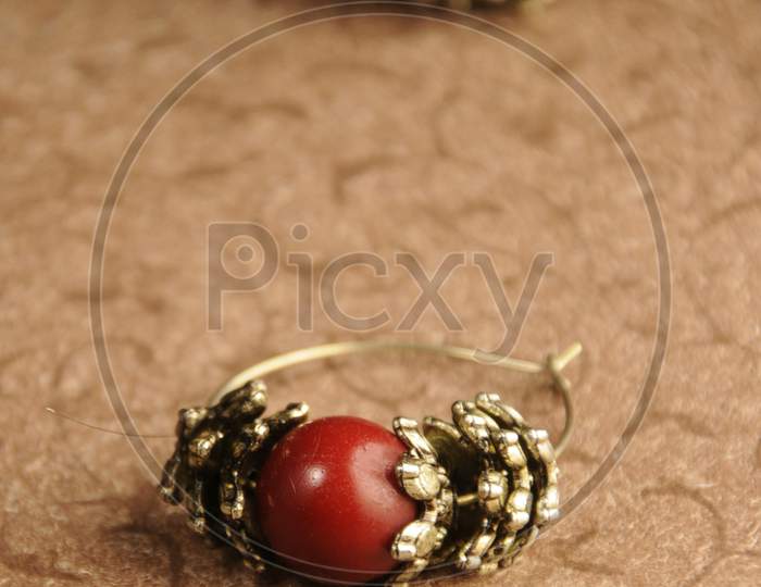 Close-Up Of A Pair Of Red Earrings