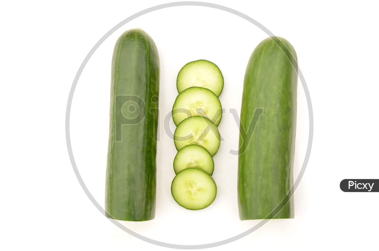 Closeup The Pair Of Sliced Green Ripe Cucumber Isolated On White Background.