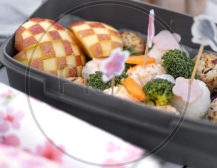 grilled salmon steak with vegetables, Delicious picnic with cherry tree flowers