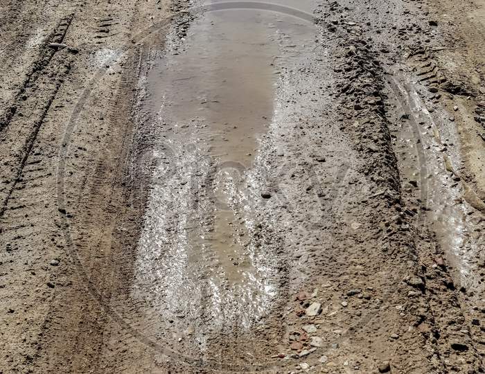 Close Up On Tire Tracks On A Muddy Road.