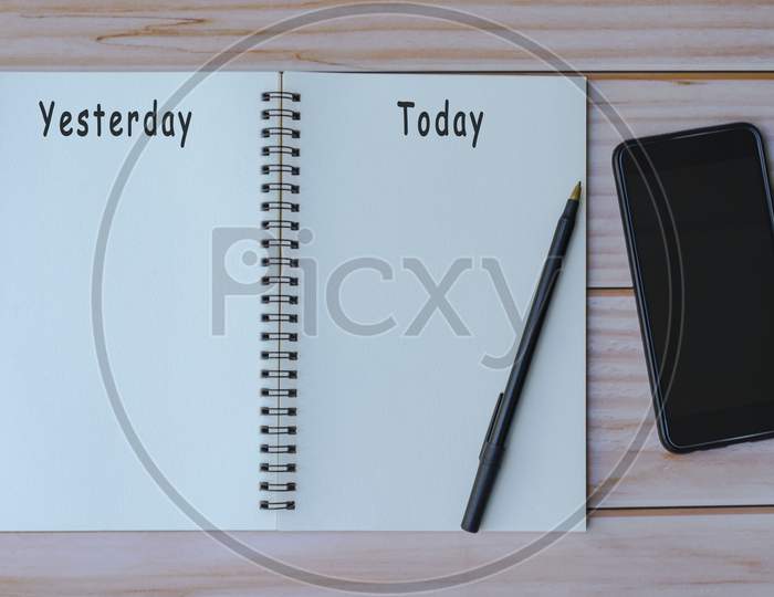 Yesterday And Today Written On Notepad. Flat Lay, Top View