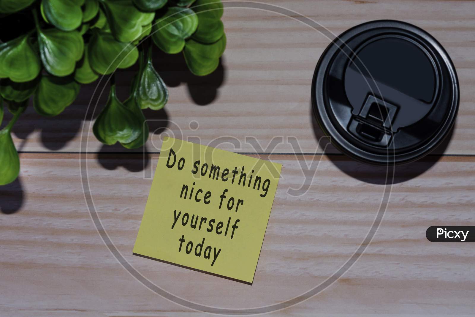 Text On Yellow Stick Note With Coffee On Wooden Table