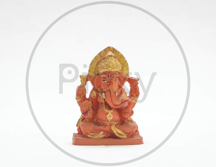 hindu god lord ganesh orange painted statue