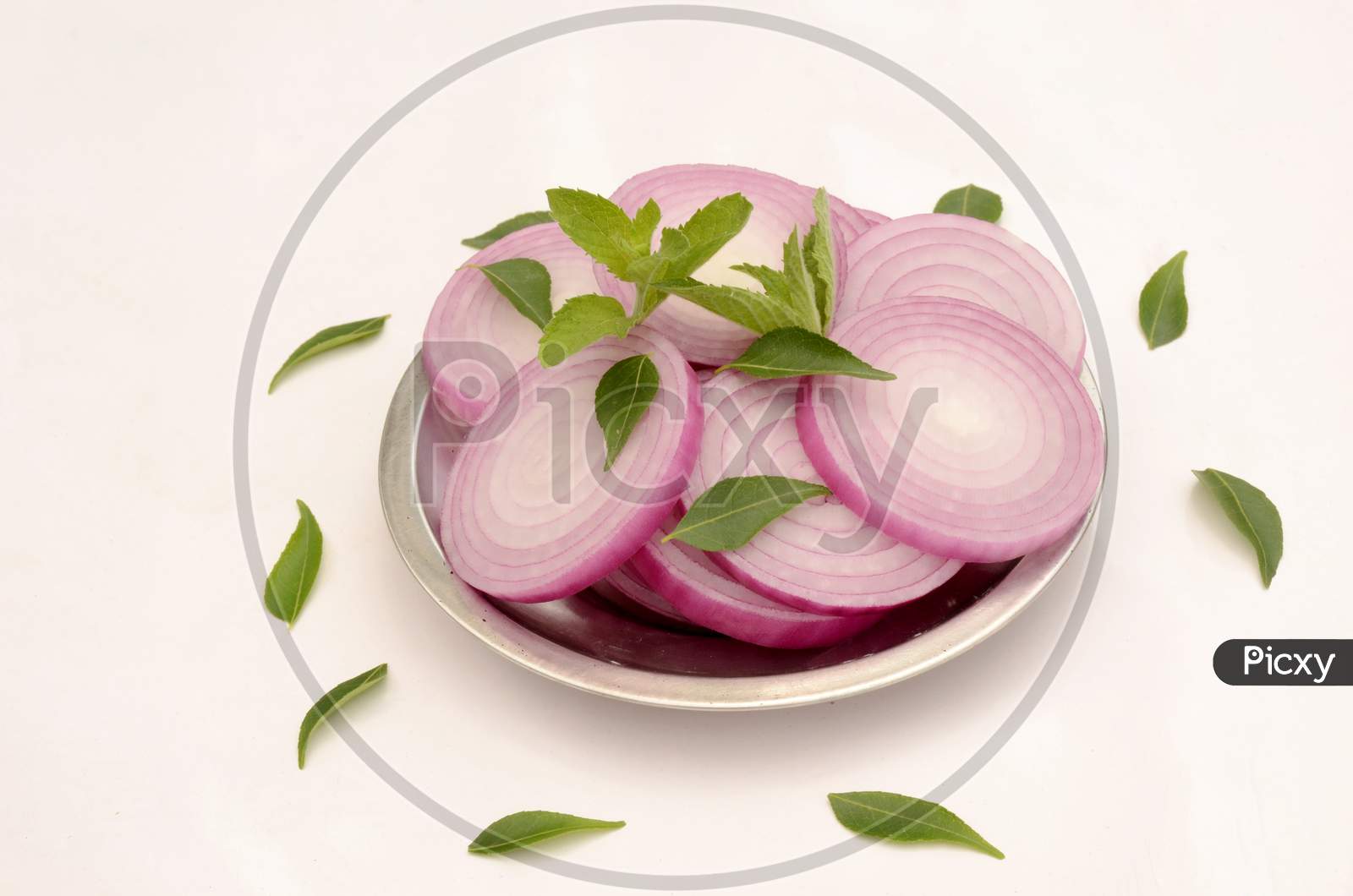Closeup Sliced Onion In The Plate Isolated On White Background.