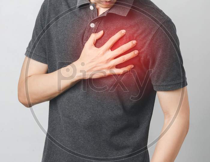 Man has chest pain suffering by heart disease, Cardiovascular disease, heart attack. Health care concept