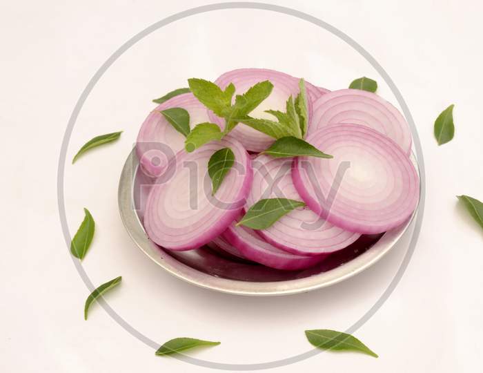 Closeup Sliced Onion In The Plate Isolated On White Background.