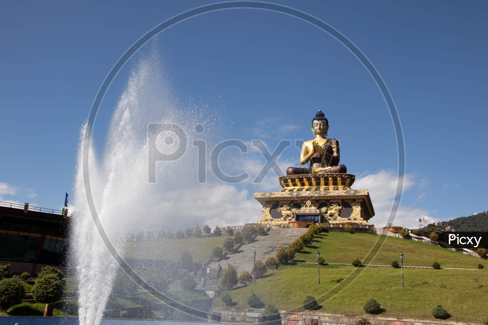 Buddha statue at the Buddha park with blue sky and clouds in the background