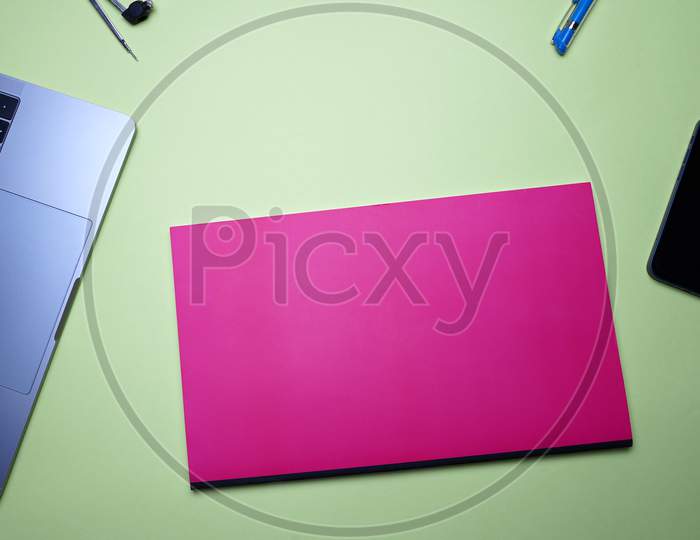Office Flat Lay, Business, Student And Homework. Laptop, Compass, Pen And Notebook On Green Background
