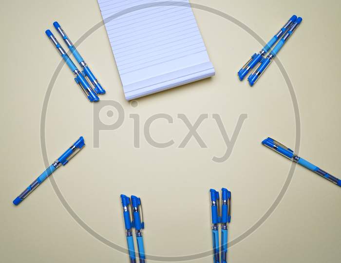 Business, Office, Student, Education Flat Lay, Table Top. Notepad And Pen On Yellow Background