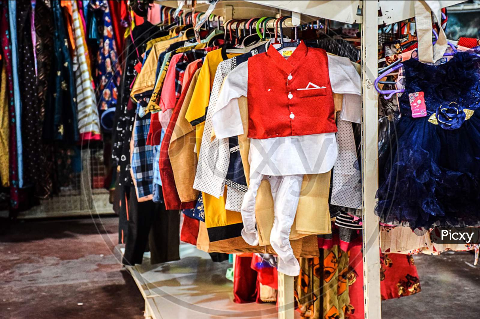Stock Photo Of Children Cloths Hanging On Hanger In The Display Of Kids Clothing Store