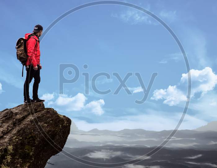 Person On Top Of Mountain