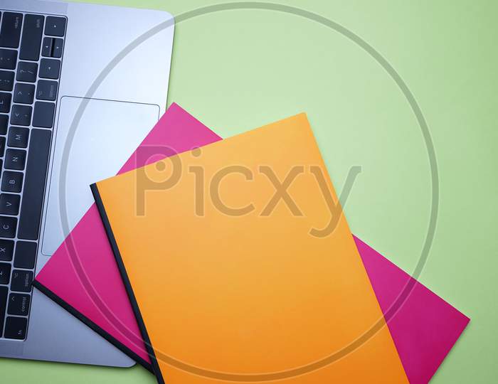 Business, Office, Student, Education Flat Lay, Table Top. Laptop, Colorful Notebook On Green Background