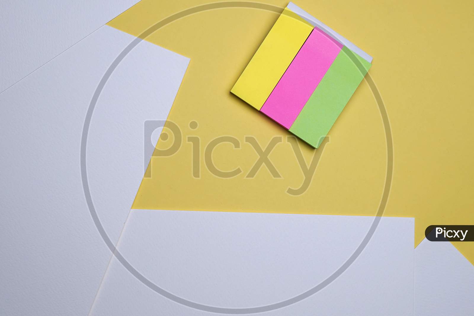 Creative Student, Homework Flat Lay, Table Top. White Sheets And Sticky Notes On Yellow Background