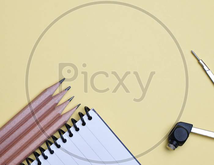 Flat Lay, Table Top View Of Pencil, Compass And Spiral Notebook. Office, Business Table Top