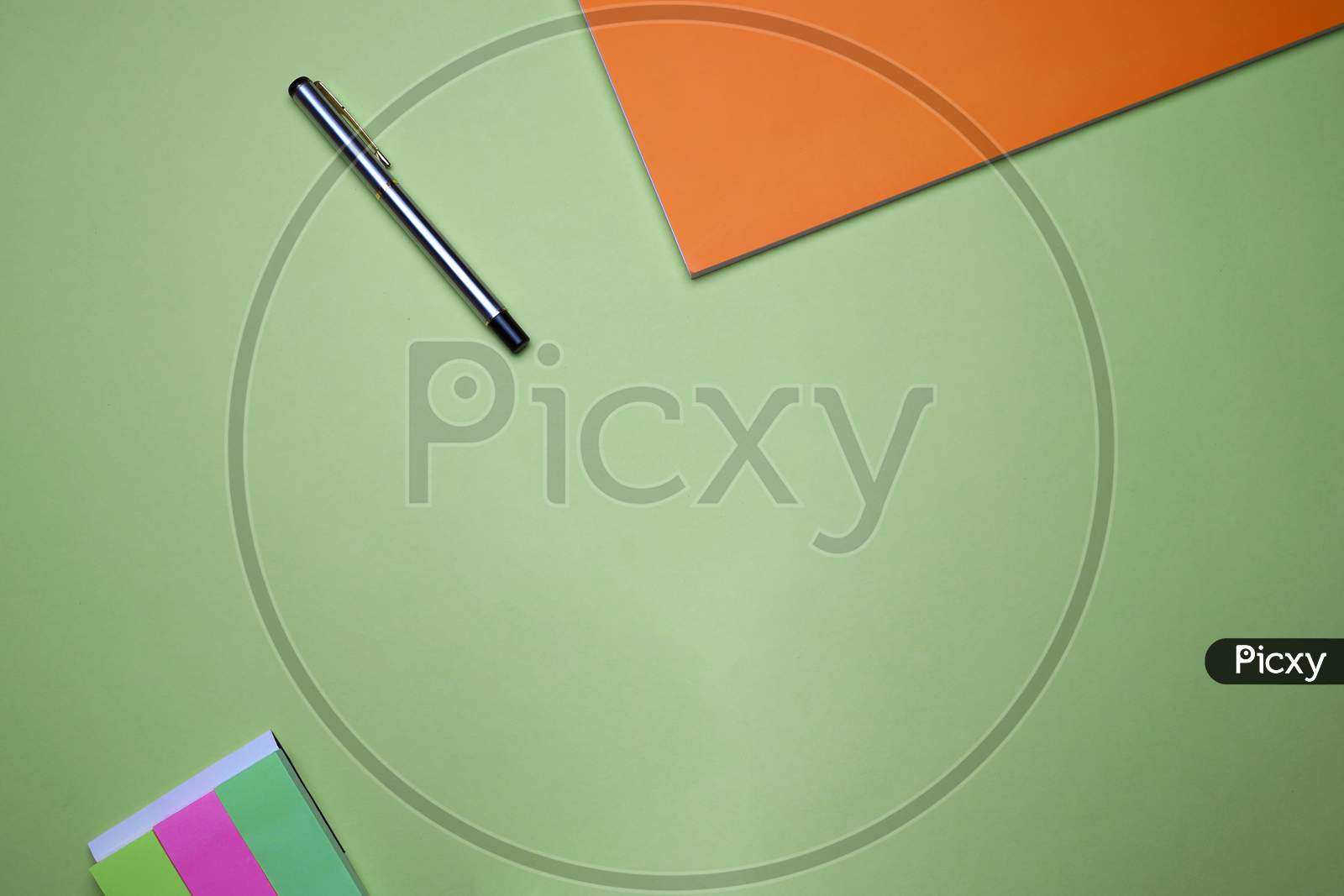 Business, Office, Student, Education Flat Lay, Table Top. Sticky Notes, Orange Notebook, Pen On Green Background