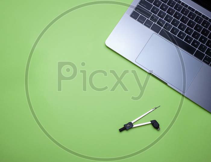Business, Office, Student, Education Flat Lay, Table Top. Laptop, Compass On Green Background