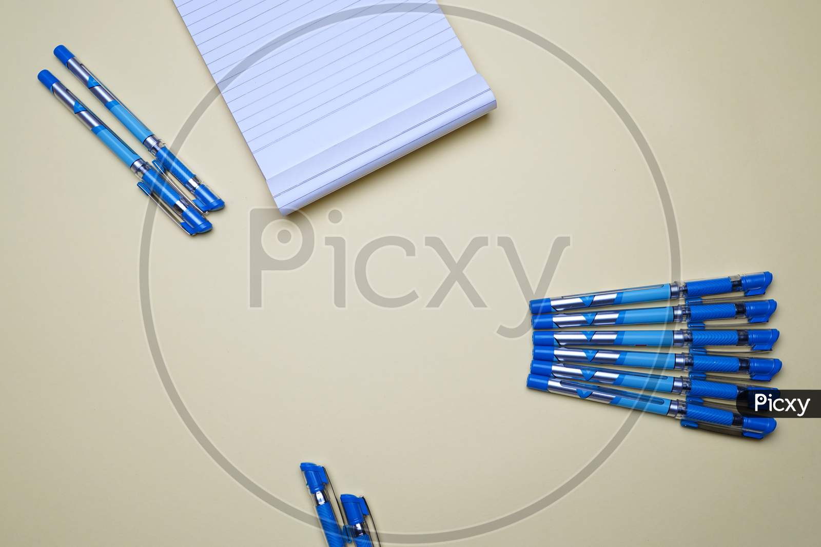 Business, Office, Student, Education Flat Lay, Table Top. Notepad, Pens Placed Creatively On Yellow Background