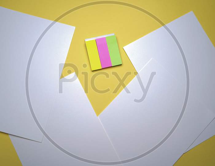 Business, Office, Student, Education Flat Lay, Table Top. Sticky Notes, White Sheets On Yellow Background