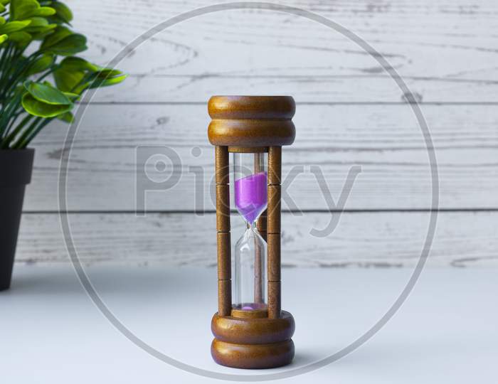 Hourglass As Time Passing Concept For Business Deadline And Running Out Of Time