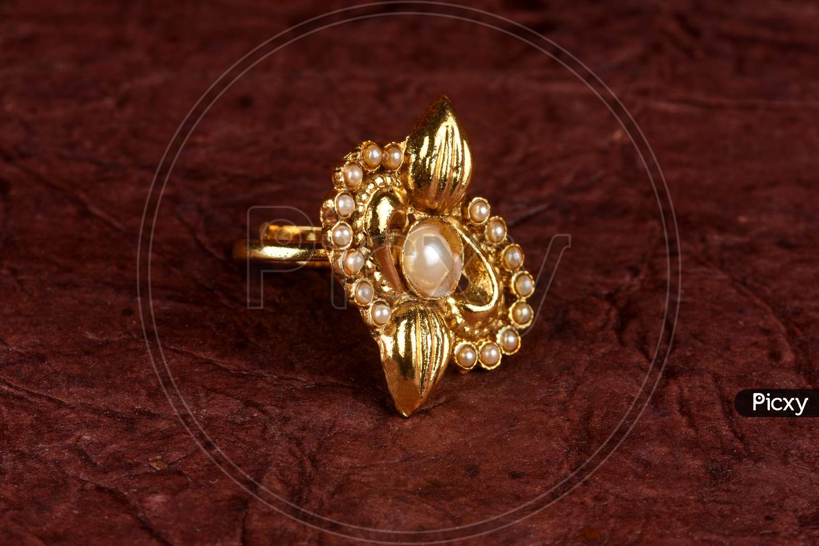 Glamorous Antique Gold Ring On Textured Background. Luxury Female Jewelry, Indian Traditional Jewellery,Bridal Gold Ring Wedding Jewellery,Vintage Ring
