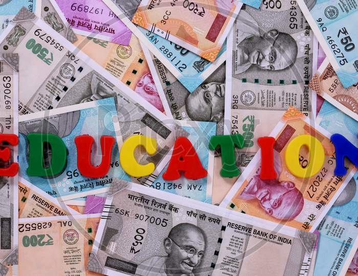 Education Concept,Education Alphabet On Money Background,Indian Currency, Rupee, Indian Rupee,Indian Money, Business, Finance, Investment, Saving And Corruption Concept - Image