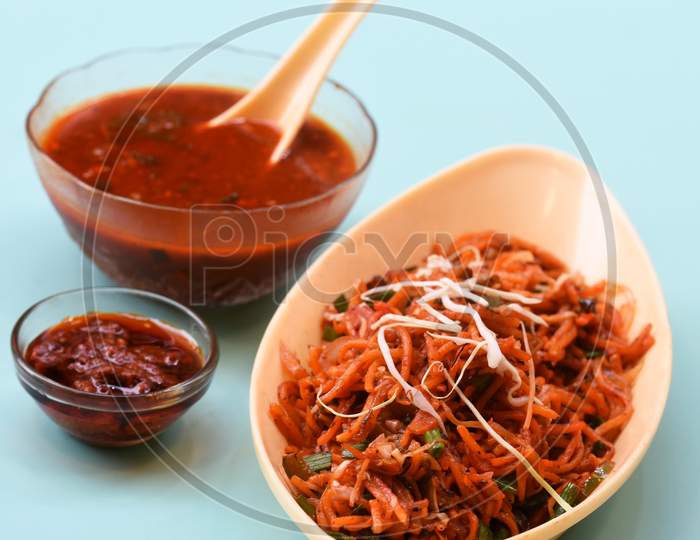 Schezwan Noodles Or Manchurian Hakka Or Vegetable Hakka Noodles Or Chow Mein Is A Popular Indochinese Food Served In A Bowl. Indian Chinese Food, Selective Focus
