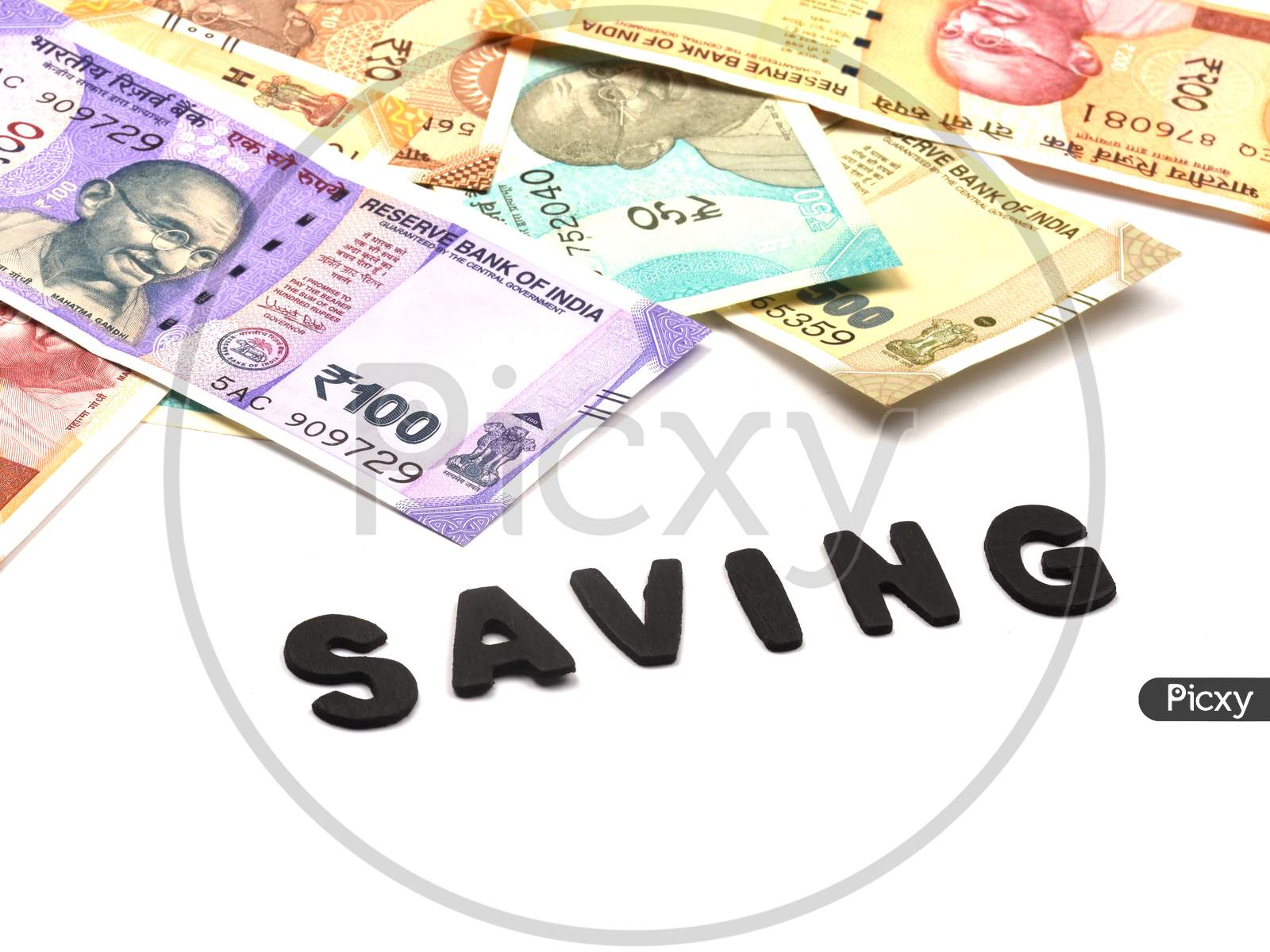 Saving Money Concept,Saving Alphabet On Money Background,Indian Currency, Rupee, Indian Rupee,Indian Money, Business, Finance, Investment, Saving And Corruption Concept - Image