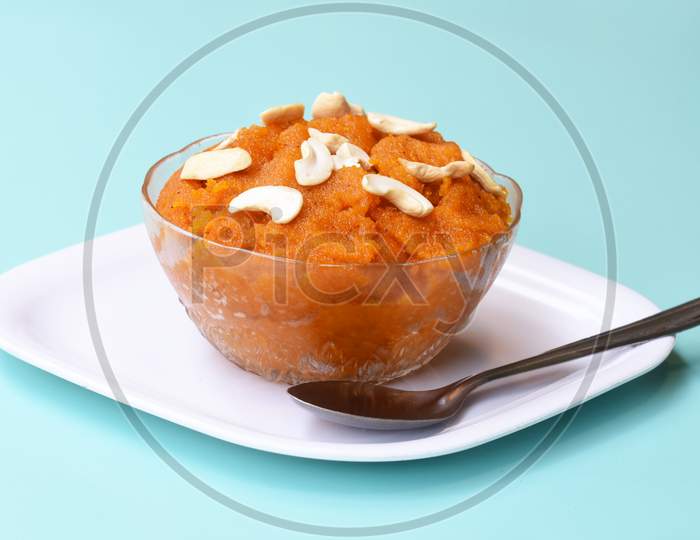 Indian Traditional Sweet,Plain Semolinasuji Halwa Also Known As Sweet Rava Sheera Or Shira - Indian Festival Sweet Garnished With Dry Fruitsserved In A Plate Or Bowl,Indian Dessert