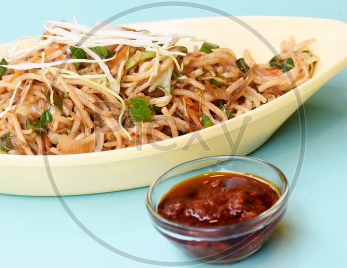 Vegetable Hakka Noodles Or Manchurian Hakka Or Schezwan Noodles Or Chow Mein Is A Popular Indochinese Food Served In A Bowl. Indian Chinese Food, Selective Focus
