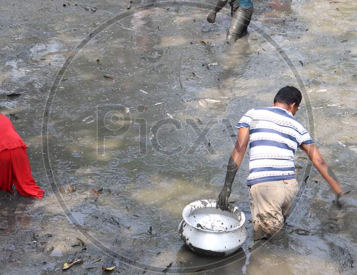 A Fisher Man With Equipment On River