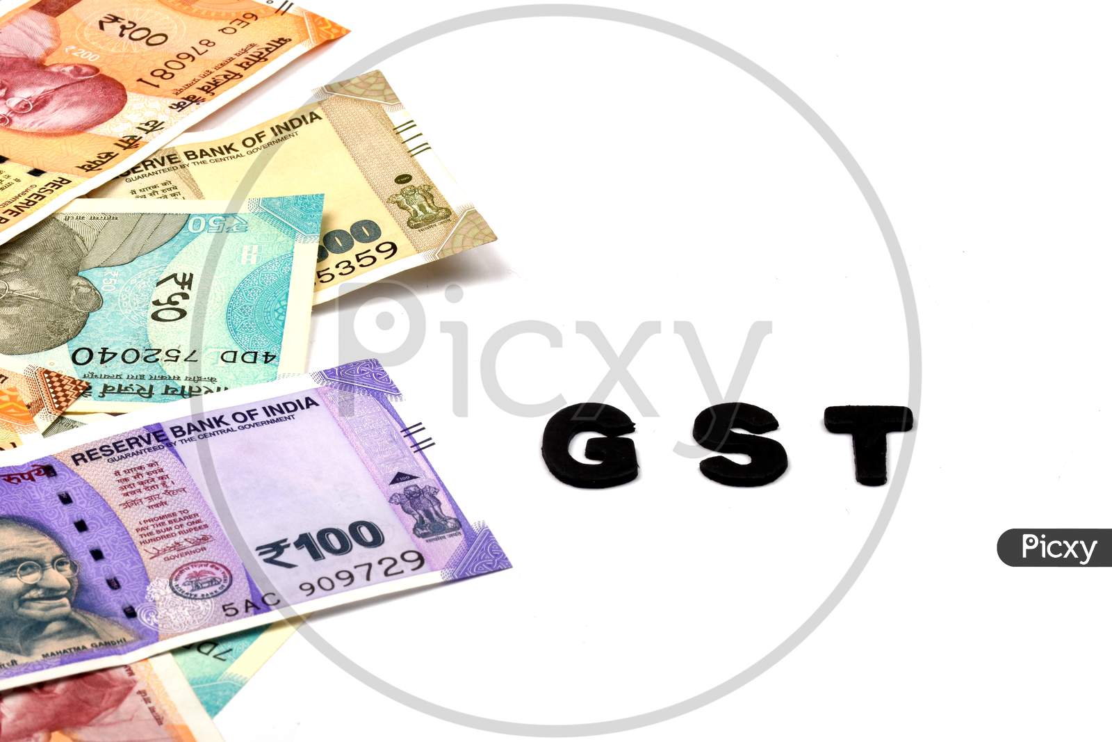 Gst Concept,Gst Alphabet On Money Background,Business And Financial Concept Idea,Indian Currency, Rupee, Indian Rupee,Indian Money, Business, Finance, Investment, Saving And Corruption - Image