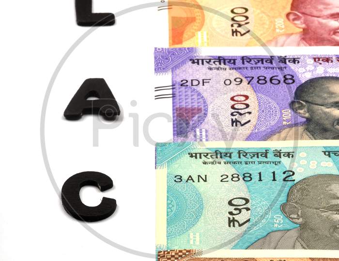 Black Money Concept,Black Alphabet On Money Background,Indian Currency, Rupee, Indian Rupee,Indian Money, Business, Finance, Investment, Saving And Corruption Concept - Image