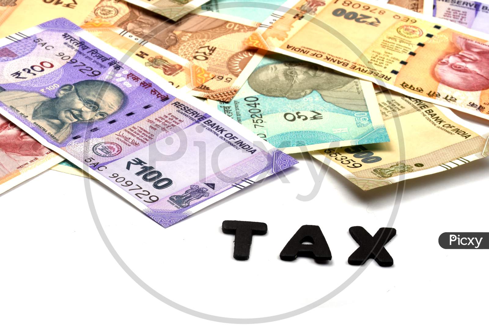 Tax Concept,Tax Alphabet On Money Background,Business And Financial Concept Idea,Indian Currency, Rupee, Indian Rupee,Indian Money, Business, Finance, Investment, Saving And Corruption  - Image