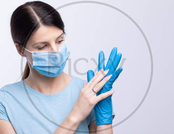 Nurse Or Doctor Wearing And Checking Protective Equipment Against Viruses And Bacterial Disease