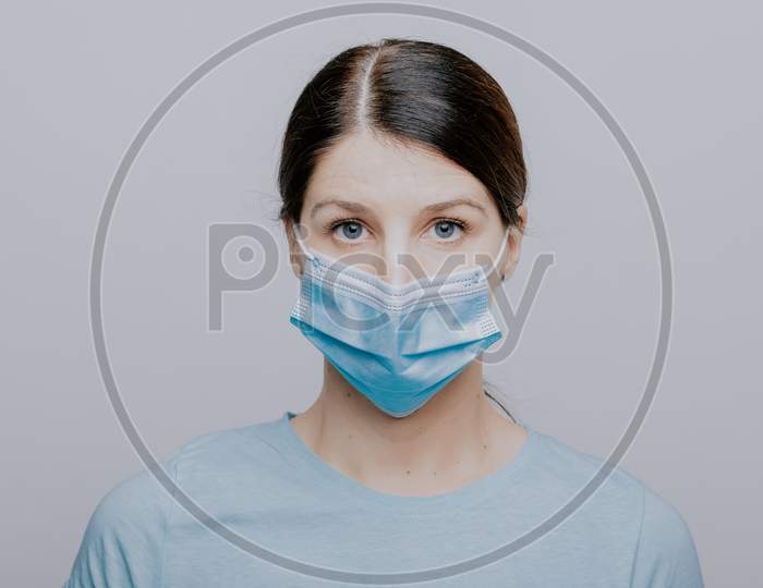 Worried Nurse, Doctor Or Scientist Portrait Behind Facemask
