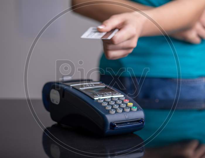 Contactless Payment With Pos Terminal Using Credit Card Stock Photo