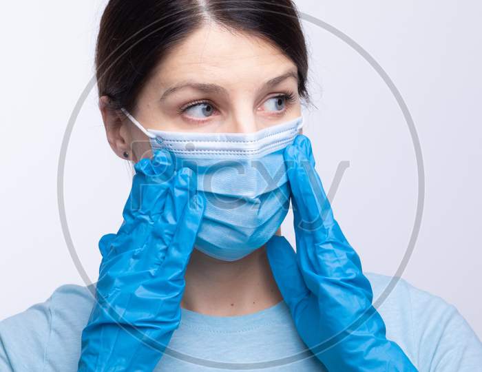Nurse Or Doctor Wearing And Checking Protective Equipment Against Viruses And Bacterial Disease