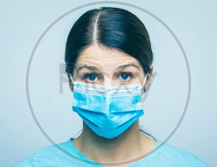 Worried Nurse, Doctor Or Scientist Portrait Behind Facemask