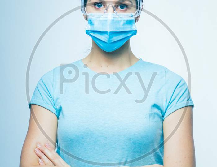 Worried Nurse, Doctor Or Scientist Portrait Behind Facemask And Protective Glasses