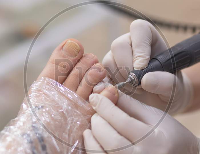 Female Foot In Process Of Pedicure Procedure Stock Photo