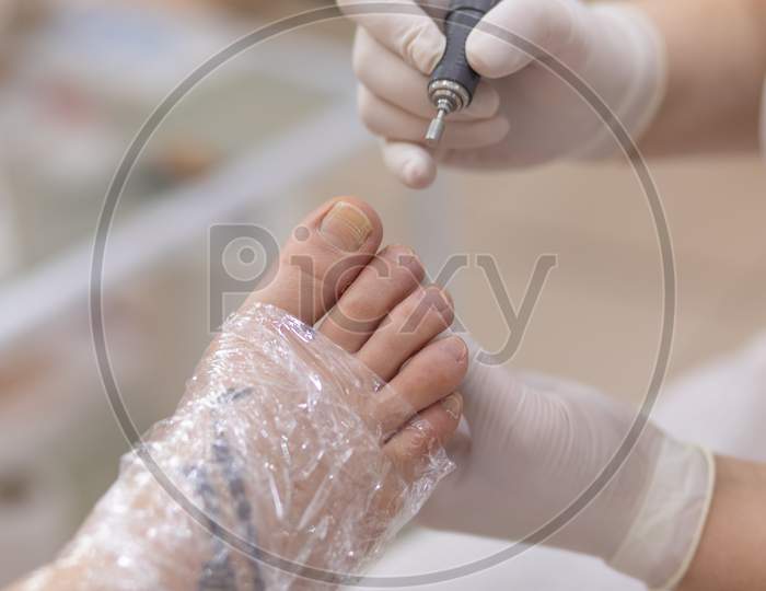 Female Foot In Process Of Pedicure Procedure Stock Photo