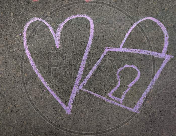 Love Symbol And Lock Hand Drawn Using Violet Color Chalk On Grey Background.
