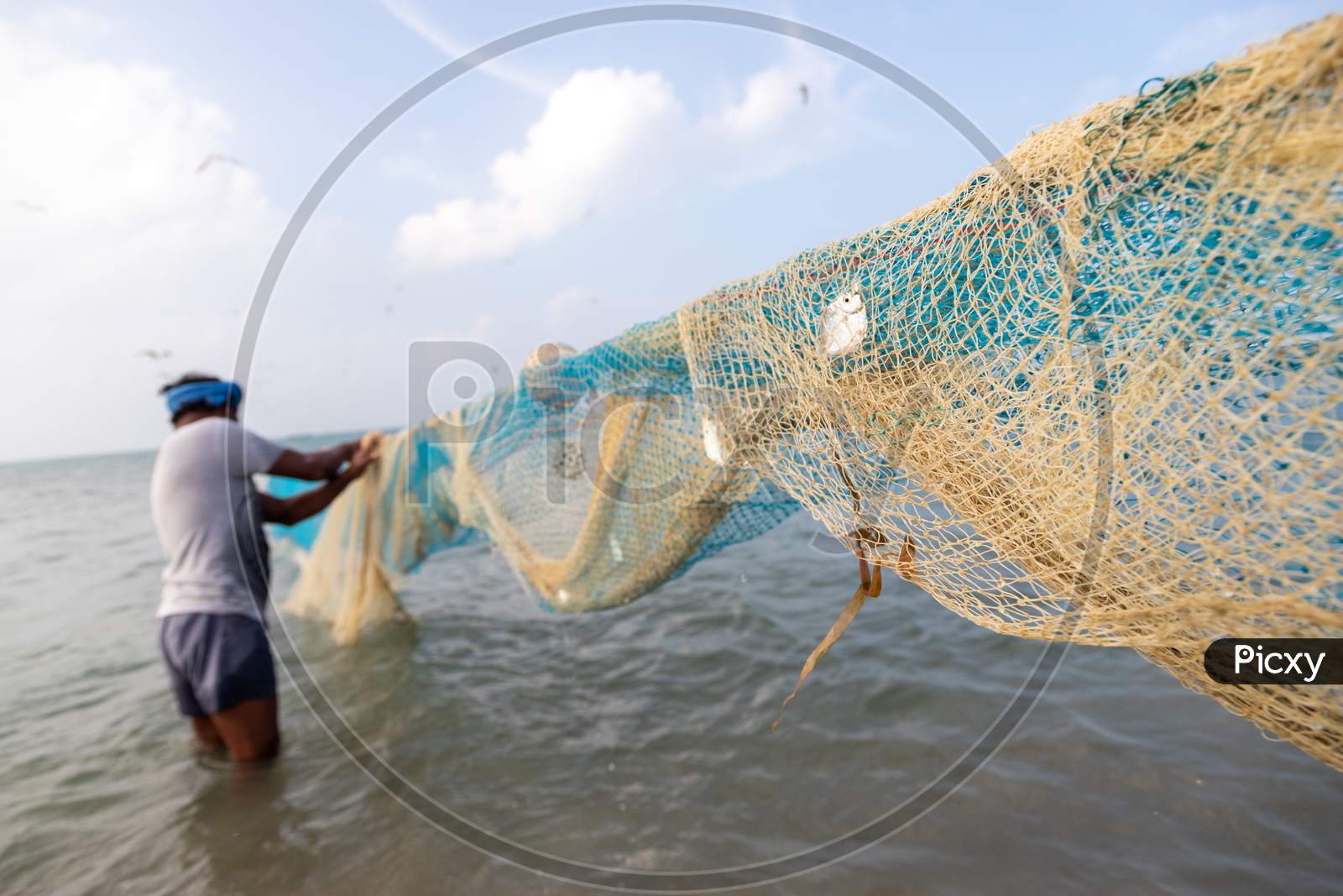Chennai, Tamil Nadu, India - Rameswaram 19 01 2021: Fishing Net And The Man Holding It
