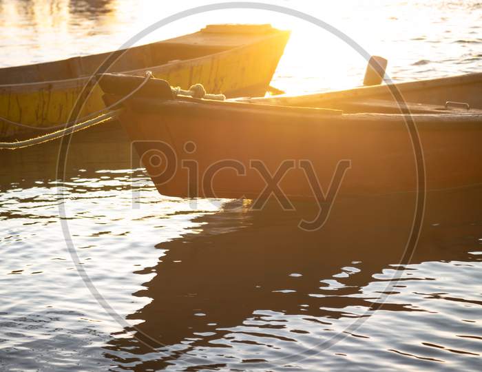 Image of Small Wooden Fisherman Boat Or Transport Moored In The Harbor.  Wooden Boat In Calm Water.-PH050030-Picxy