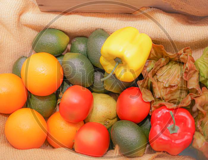 Colorful Vegetables And Fruits That Are Placed In The Basket