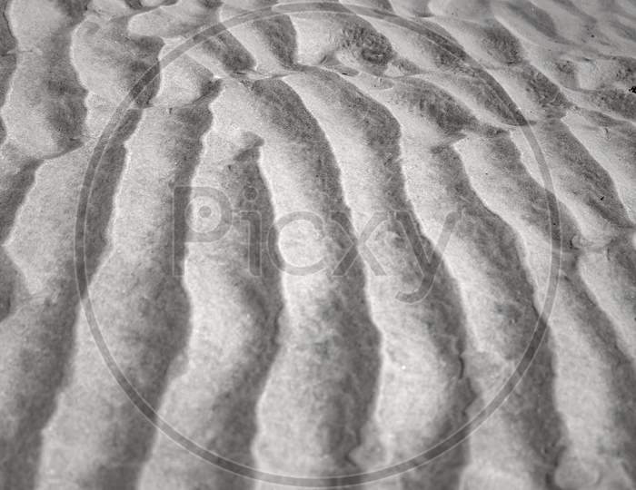 Abstract Line Patterns Formed By Sand And Wind. Concept Of Loneliness And Coldness.