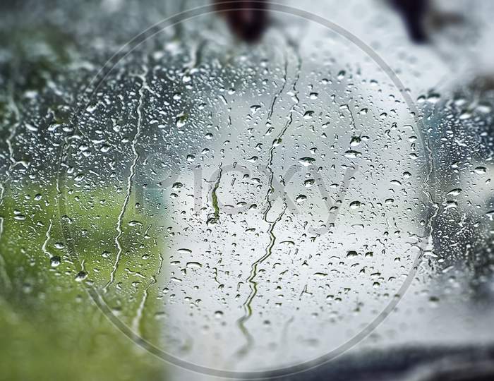 Abstract Capture Of Natural Water Drop On The Window Glass From Inside The Car With Condensation During Rainy Day Traveling On Drive By Road. Asansol, India, Asia, 13Th July 2021.